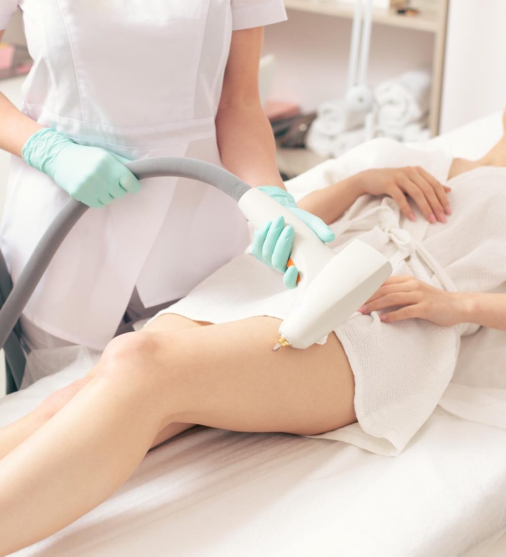 selective-focus-hand-with-modern-tool-removing-vascular-nets-leg-young-woman selective-focus-hand-with-modern-tool-removing-vascular-nets-leg-young-woman
