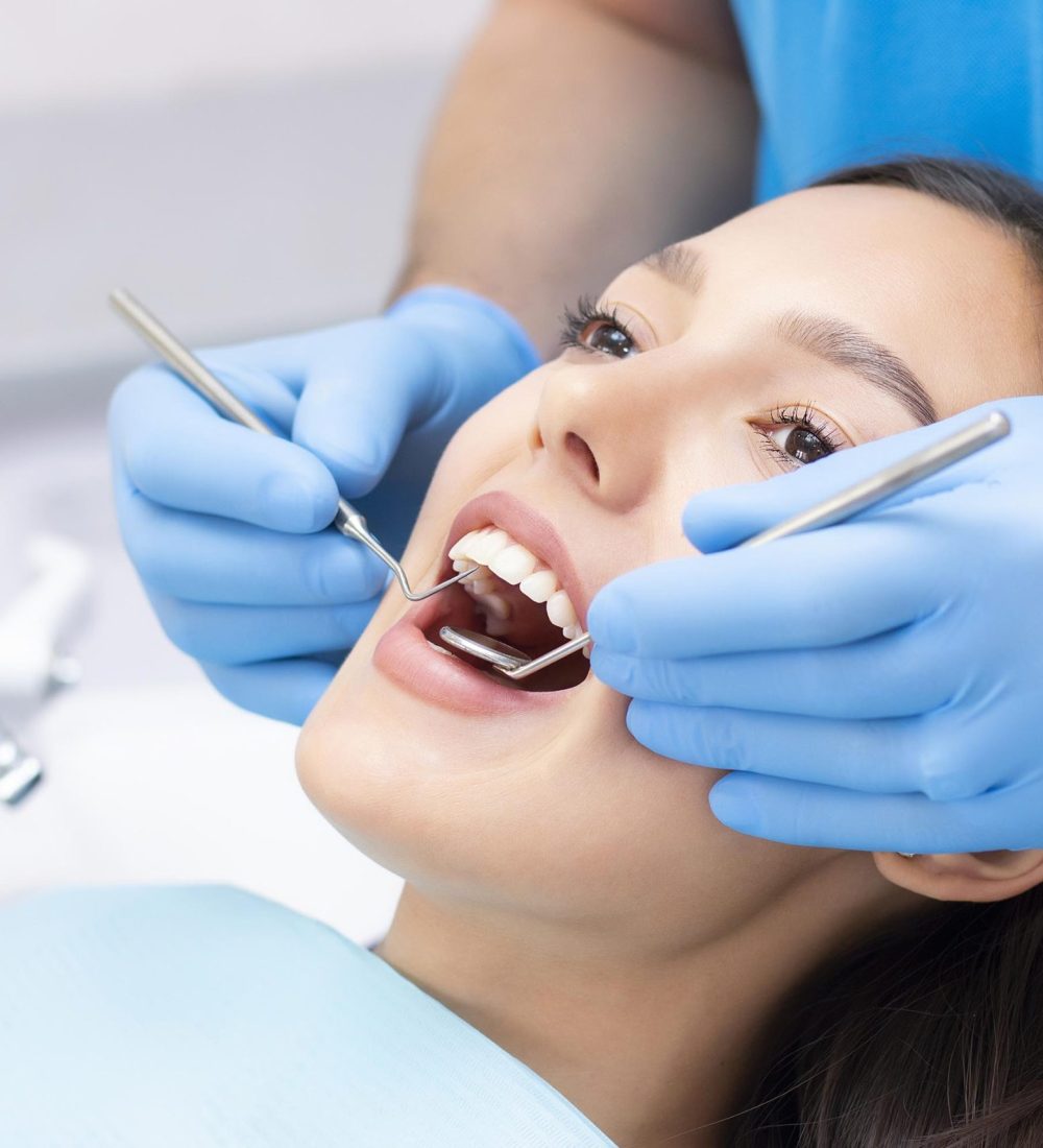 Young Female patient with pretty smile examining dental inspection at dentist clinic. Healthy teeth and medicine, stomatology concept Young Female patient with pretty smile examining dental inspection at dentist clinic. Healthy teeth and medicine, stomatology concept